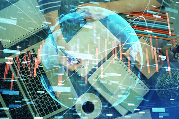 Financial chart drawn over hands taking notes background. Concept of research. Double exposure