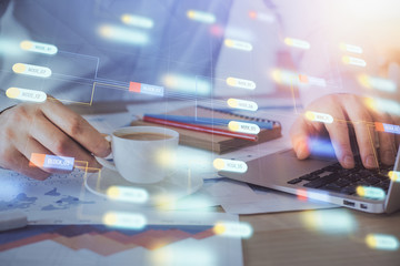 Double exposure of data internet theme hologram with man working on computer on background. Concept of innovation.