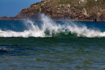 waves crashing on rocks