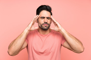 Handsome young man over isolated pink background unhappy and frustrated with something. Negative facial expression