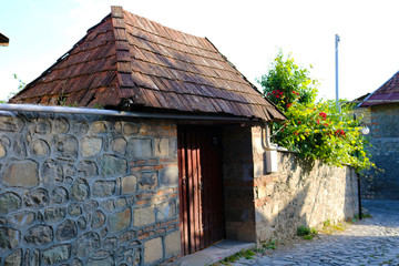 Small narrow stone streets and small houses with roof tiles in the old village.  The stone road in Kish village, Azerbaijan 