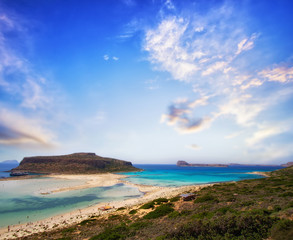 Fototapeta premium Panoramic view of Balos beach on Crete island, Greece at beautiful sunset. Crystal clear water and white sand. Travel background