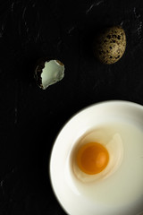Broken Quail Egg Yolk. Fresh Organic Food Concept.