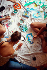 Group of young people painting