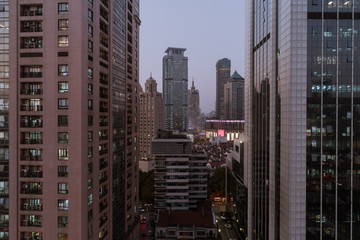 Fototapeta na wymiar Aerial view of business area and cityscape in the dusk, West Nanjing Road, Jing` an district, Shanghai