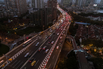 Obraz premium Aerial view of business area and cityscape in the dusk, West Nanjing Road, Jing` an district, Shanghai
