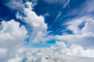 Fototapeta na wymiar Puffy Clouds on Blue Sky Background