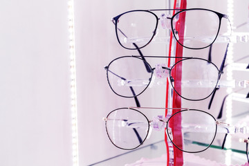 Optics store, set of glasses in shop windshield, medetsin. Place for text.