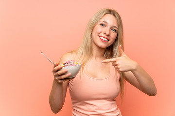 Young blonde woman having breakfast