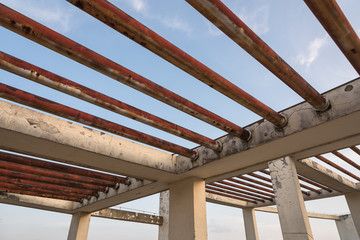 Roof concrete pillar railings and rusty iron bars