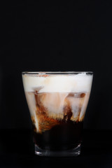 Cocktail home Lebovsky with a creamy taste, shot on a black background