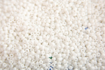 Lots of colorful fusible plastic beads used for arts and craft. Decoration for wallpaper desktop, poster, cover booklet, card.