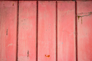 Pink worn painted fence texture