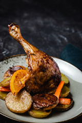 Roasted Chicken Leg with Potatoes, Carrots and Oranges - 274437079