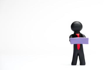 A man made from plasticine holding a blank sheet of paper on white background, aligned to the right.
