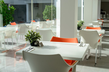 street cafe interior, outdoor wooden tables and chairs. Horizontal frame