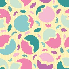 Abstract memphis style design with multicolour circles and shapes. Seamless vector pattern on subtly striped yellow background. Great for wellbeing, cosmetic products, giftwrap, packaging, stationery