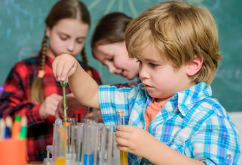 Obraz premium Laboratory Research - Scientific project For Chemical test. Science and education. chemistry lab. happy children. back to school. School chemistry laboratory. Working together to prepare for finals