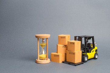 Yellow Forklift truck with cardboard boxes and a sand hourglass. Express delivery concept....