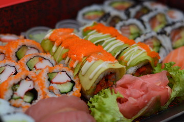a box of mixed types of sushi