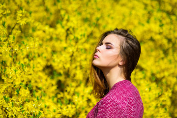 Naklejka na ściany i meble pretty woman skincare. girl like nature. fashion beauty. summer blooming trees and yellow flowers. natural beauty makeup. hair fashion. sexy woman in spring blossom. Summer fairy portrait