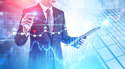 Trader working with digital chart in city