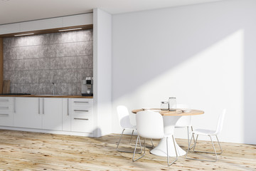 White kitchen corner with round table