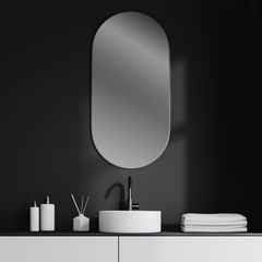 Bathroom sink in dark gray room