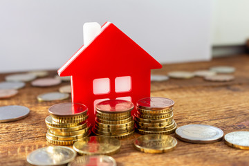 Home on the staked coins background euro pile pack real estate concept expenses property buying...