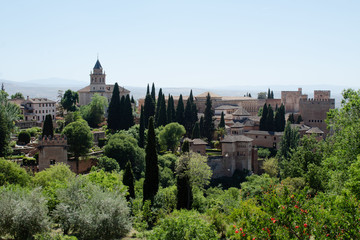 Fototapeta premium View of the Alhambra, opening from the alley in the gardens of Generalife, Granada, Andalusia, Spain