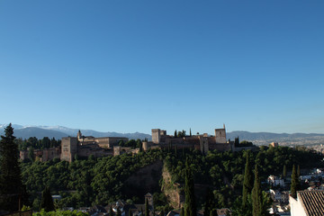 Fototapeta premium View of the Alhambra, opening from the alley in the gardens of Generalife, Granada, Andalusia, Spain
