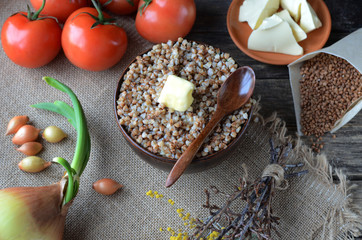 buckwheat porridge with butter in a clay bowl