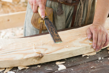 Work man chisel on a wooden board