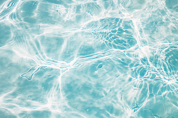 blue water in the pool in the sun close up