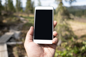 mobile phone in hand outdoors