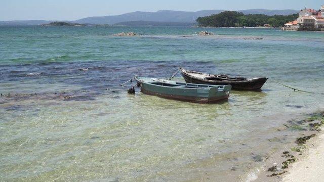 Small boats called Chalana anchored on the beach. Rias Baixas seascape, Carril, Galicia, Spain