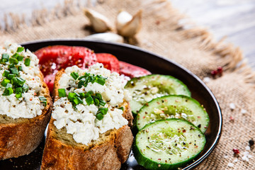 Sandwiches with cottage cheese and vegetables