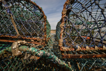 Lobster pots and rope on bright summer day in England