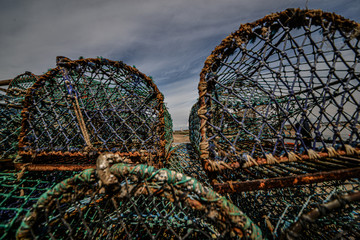 Lobster pots and rope on bright summer day in England