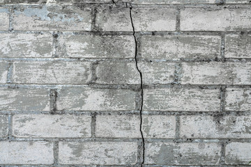 background of old white cracked brick wall