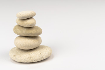 Fototapeta na wymiar stack of zen stones isolated on the left side white background