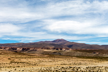 Desert landscapes with mountains in Bolivia at the dry season, dry vegetation is a natural background