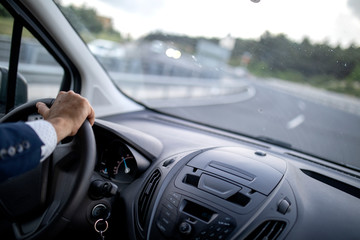 Businessman driving car