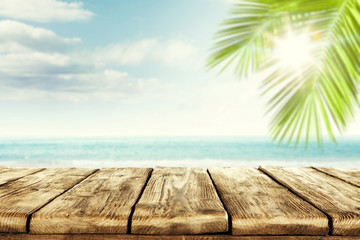 Desk of free space and blurred beach background 