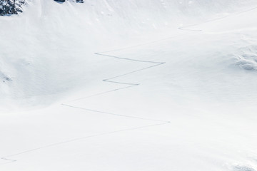 Fototapeta na wymiar ski touring tracks in the fresh powder snow