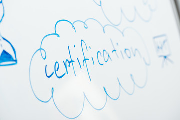 selective focus of word certification written on white flipchart