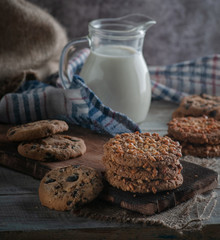 oatmeal milk on a wooden table with a towel