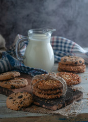 oatmeal milk on a wooden table with a towel