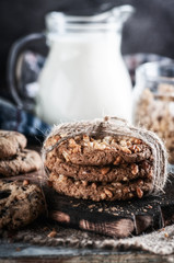 oatmeal milk on a wooden table with a towel