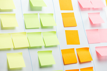 white office board with colorful sticky notes and copy space